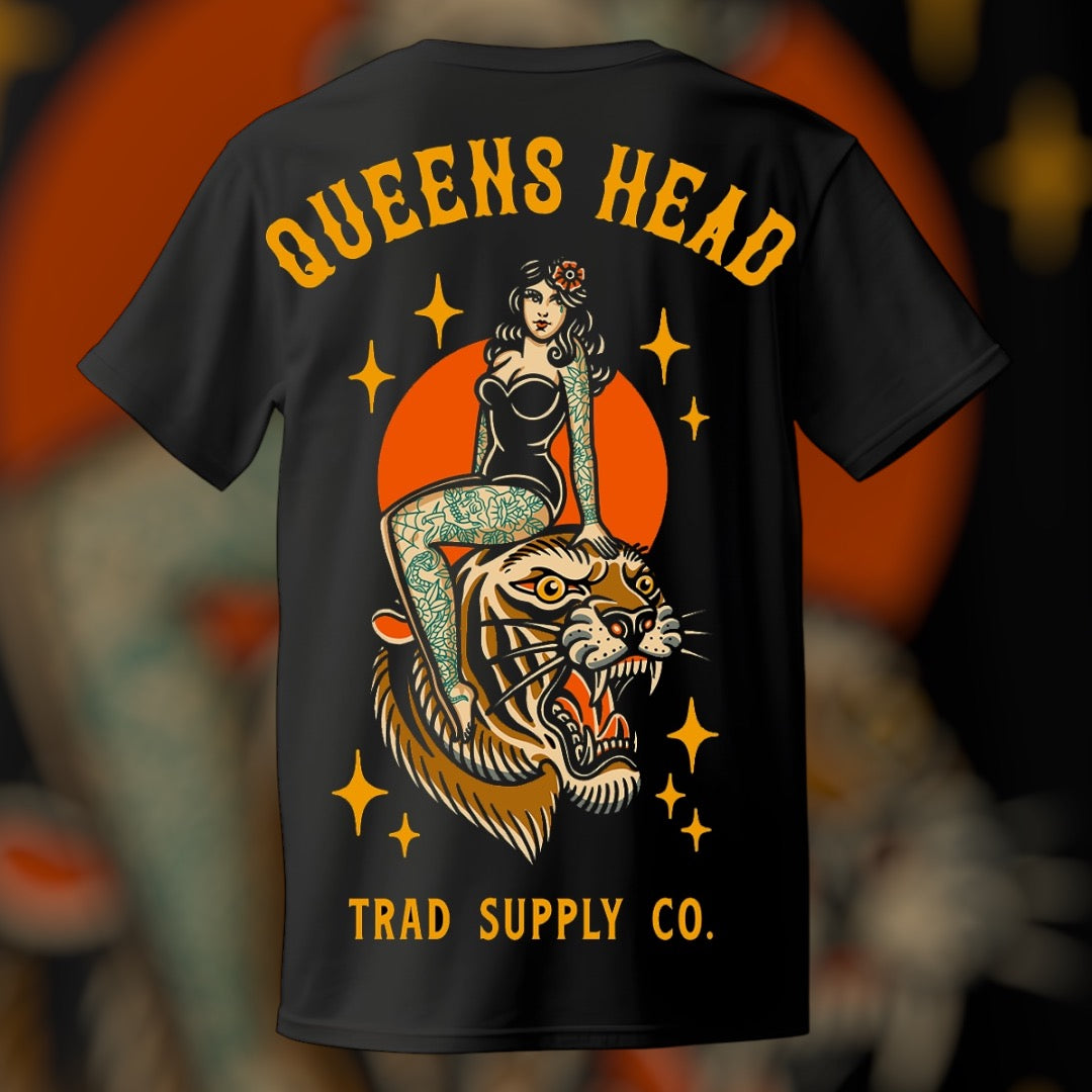 Black t-shirt with a vibrant multicolor print featuring a tiger and pin up, with the text 'QUEENS HEAD TRAD SUPPLY CO.' on the upper back.